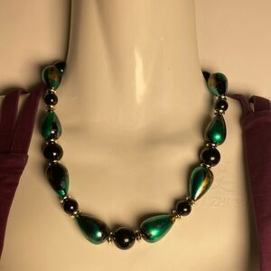 Vintage women green and black stringed acrylic beaded necklace. Size 18”. Used.